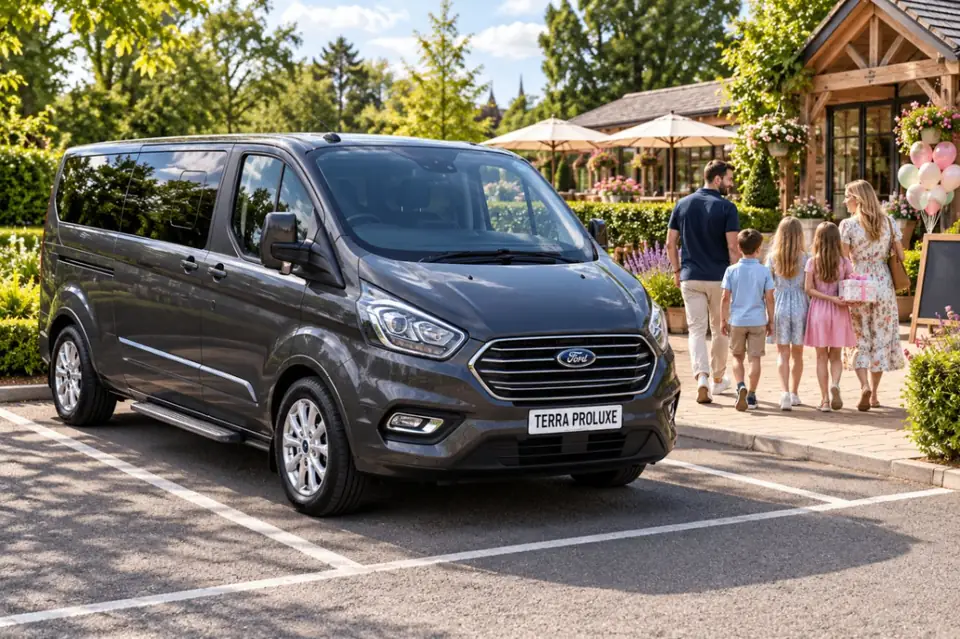 Grey Ford Tourneo Custom parked beside a family at an outdoor venue.