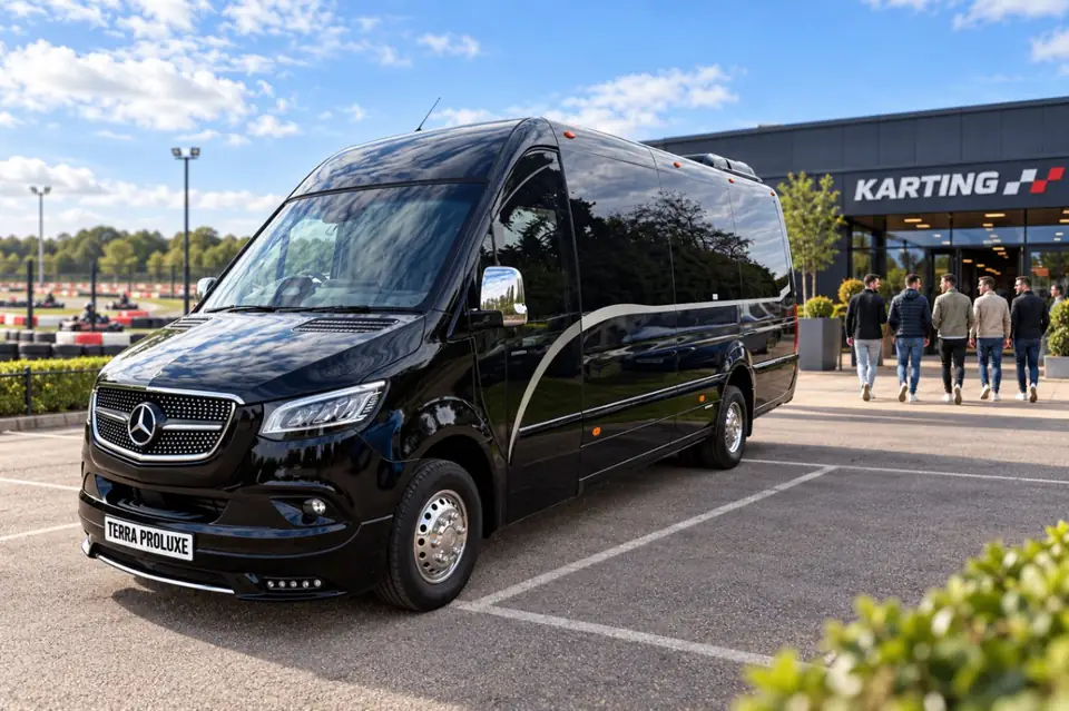 Black Mercedes-Benz Sprinter parked outside a karting venue.