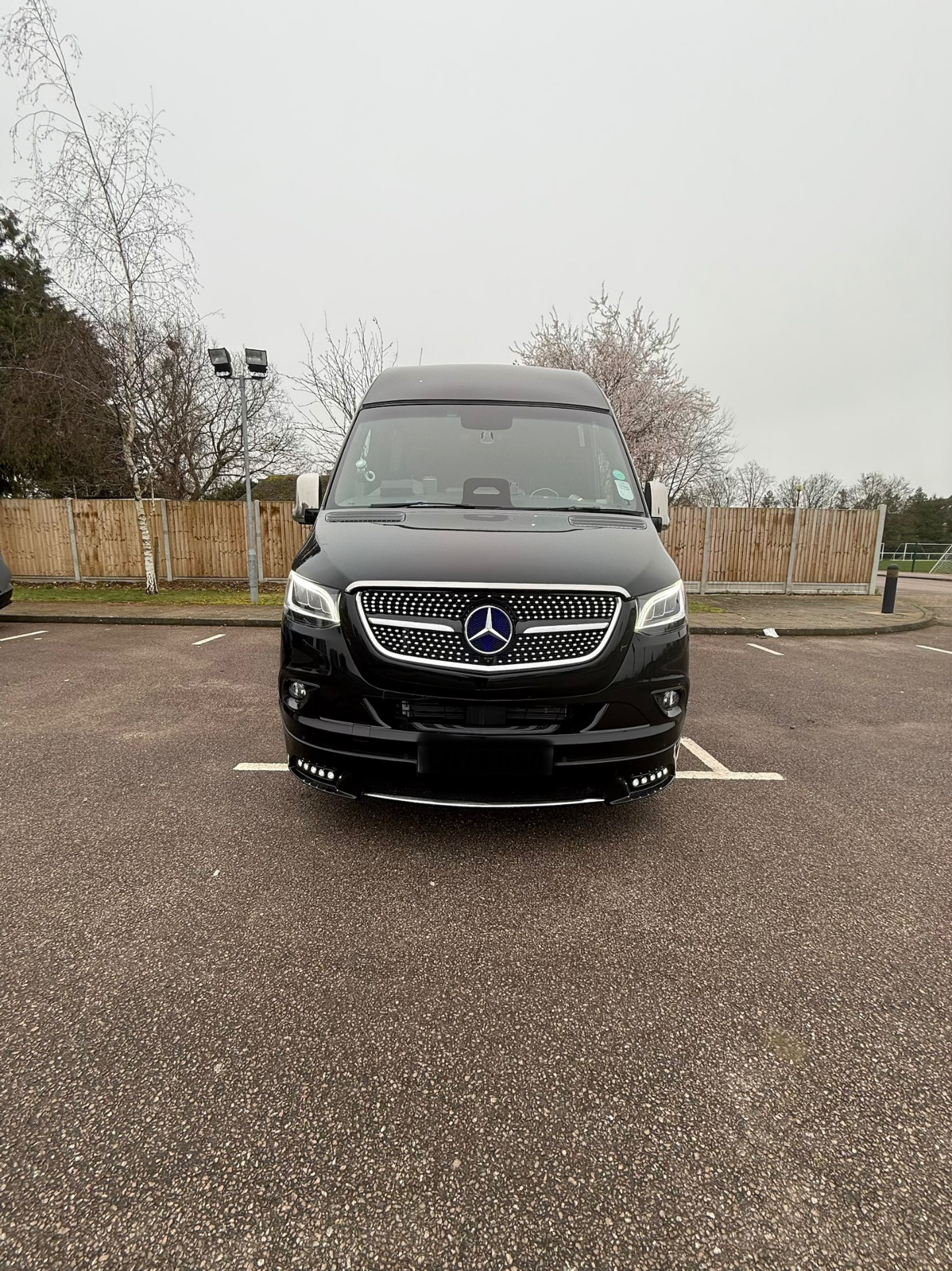 Front grille and LED headlights of the Mercedes-Benz Sprinter executive minibus