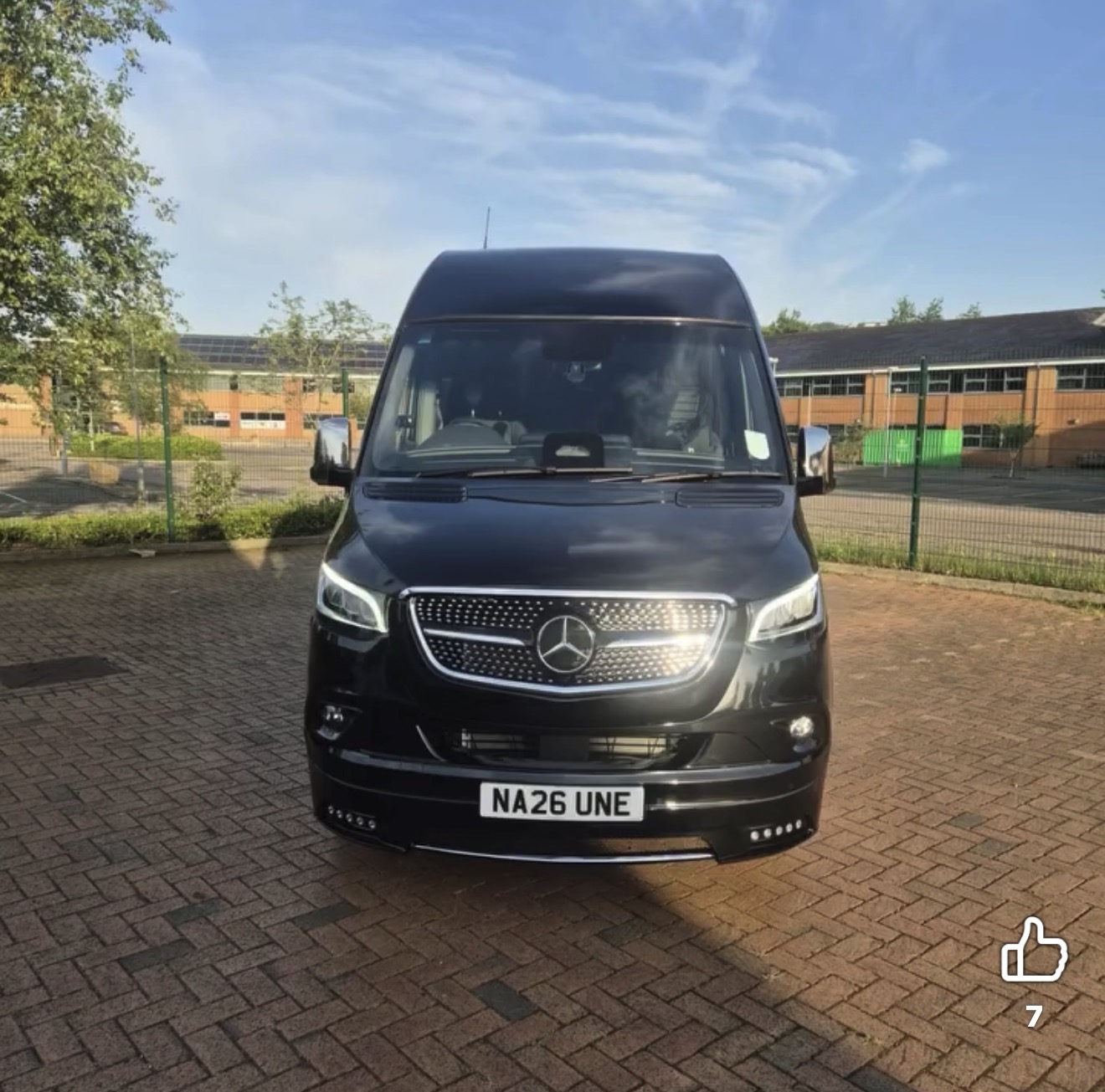 Black Mercedes-Benz Sprinter 16-seat executive minibus parked, front view